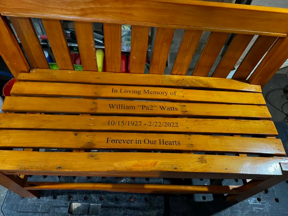 Personalized wooden memorial bench with engraved dedication